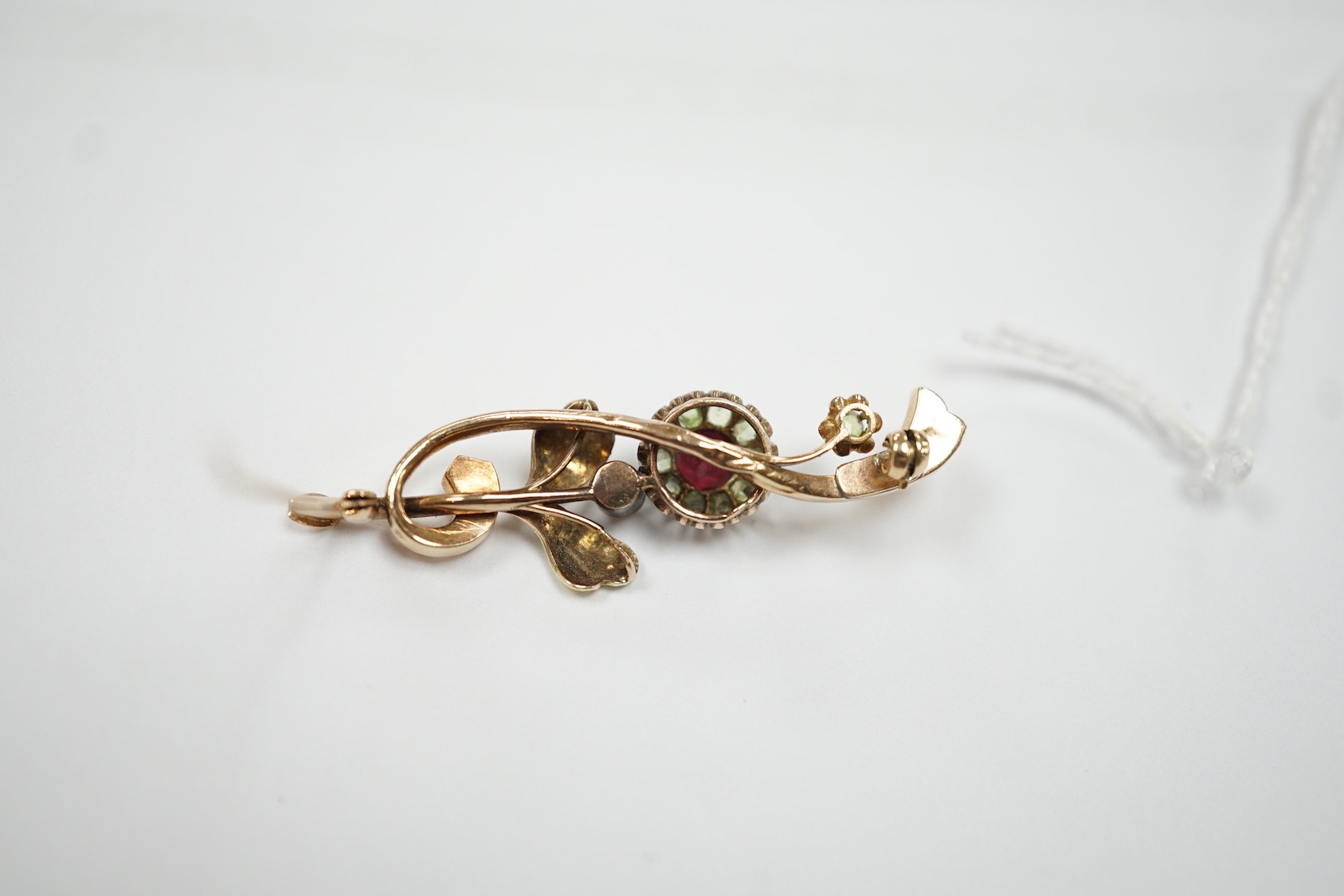 An early to mid 20th century Russian 56 zolotnik yellow metal, garnet? and split pearl set foliate brooch, 48mm, gross 4.3 grams.
